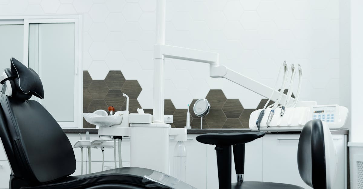 Clean and organized dental office featuring a modern dental chair and equipment.